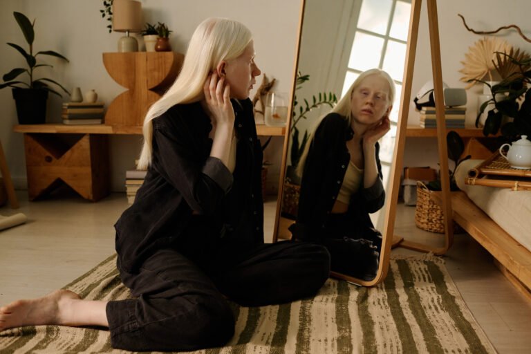 White-haired Girl Looking In Mirror