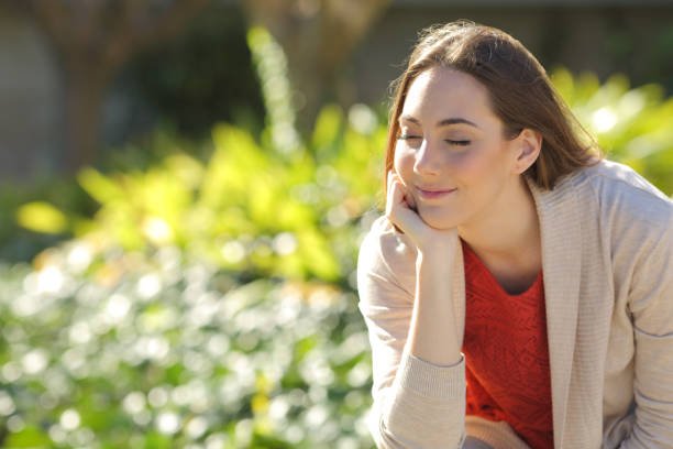 Woman resting relaxing in a park a sunny day