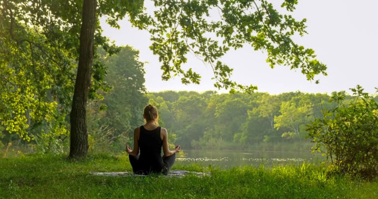 Beautiful free woman sitting in meditation pose in green forest. Lotus position, zen yoga meditation practice in nature
sitting in lotus pose, healthy lifestyle, meditation concept