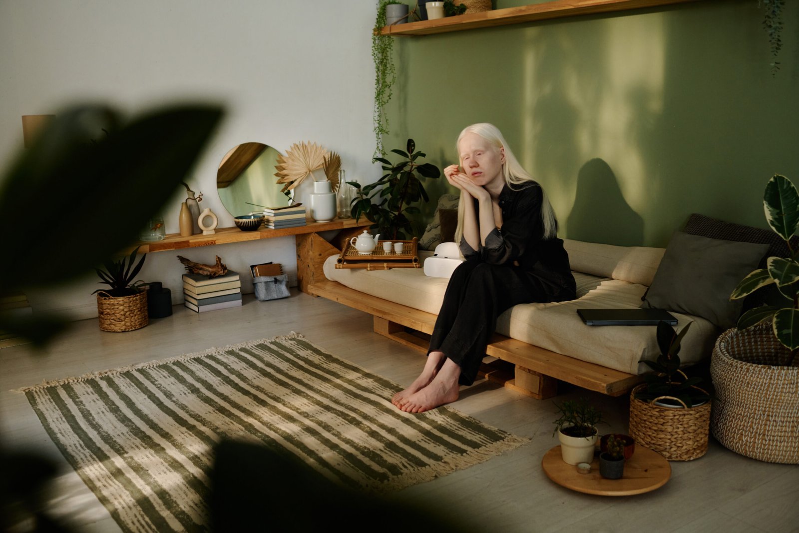 Young Woman With Albinism Sitting In Living Room