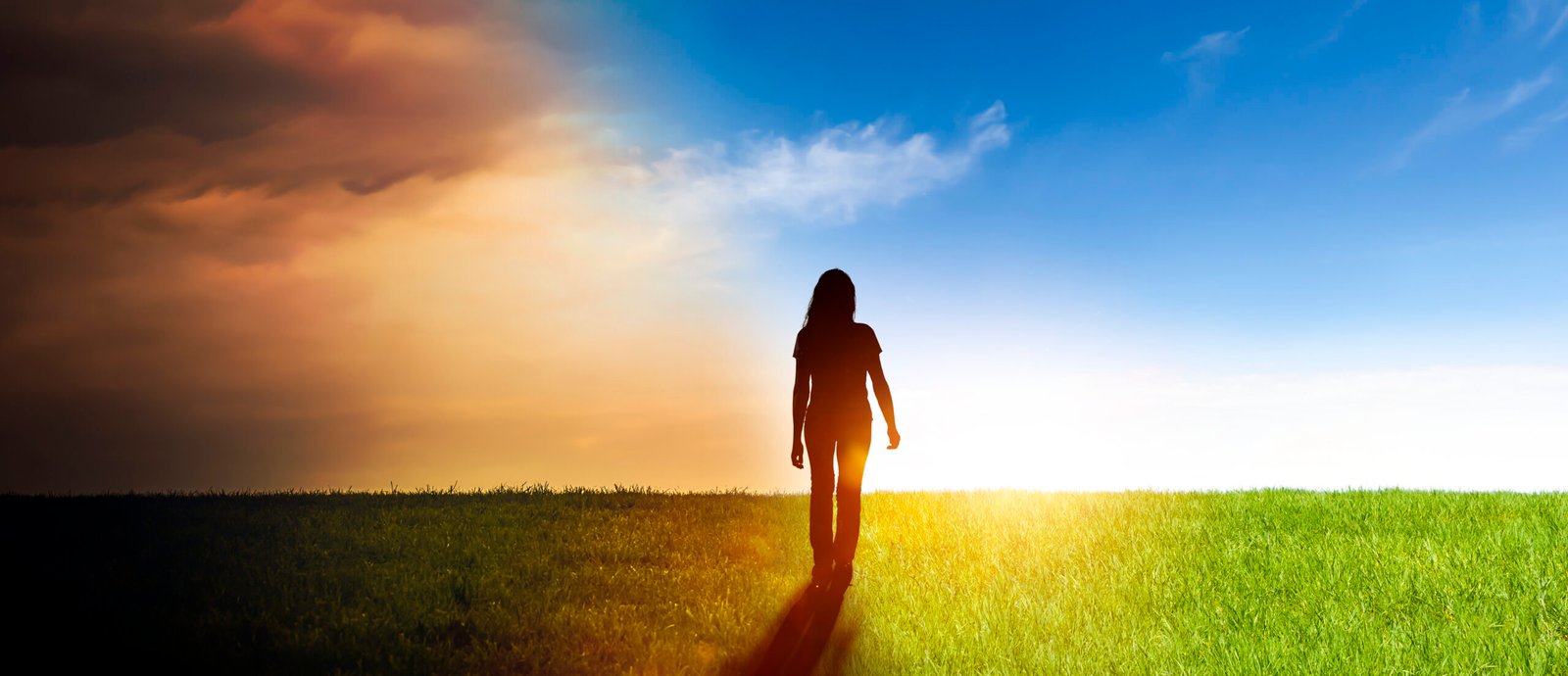 Woman in a landscape with from darkness into the light