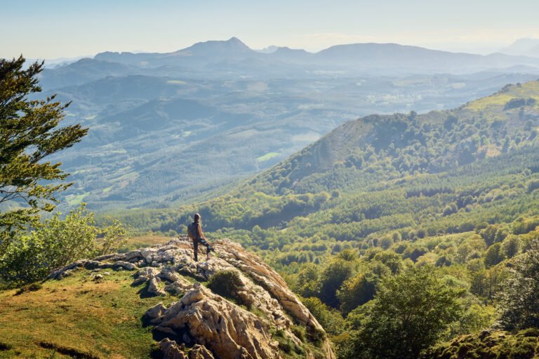 woman young hike explorer successful climb mountain gorbea