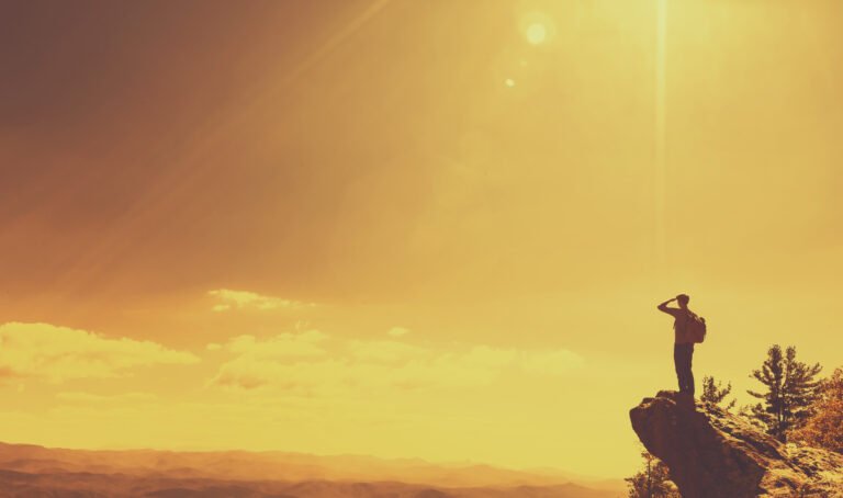 Man overlooking the mountains below