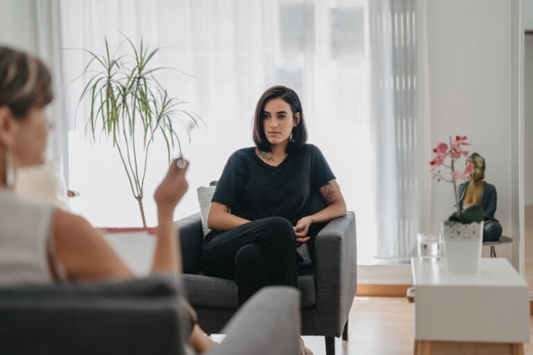 young man listens attentively to his psychologist in a session