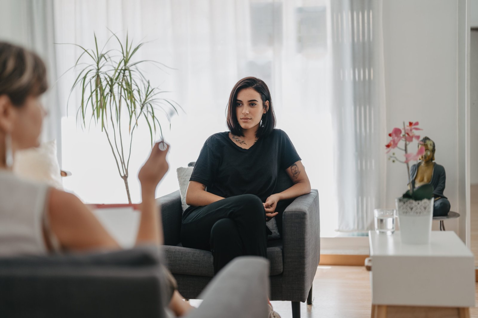 young man listens attentively to his psychologist in a session