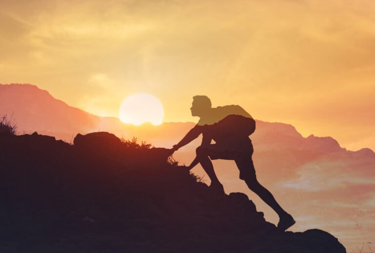 Men hiker climbing up the mountains.