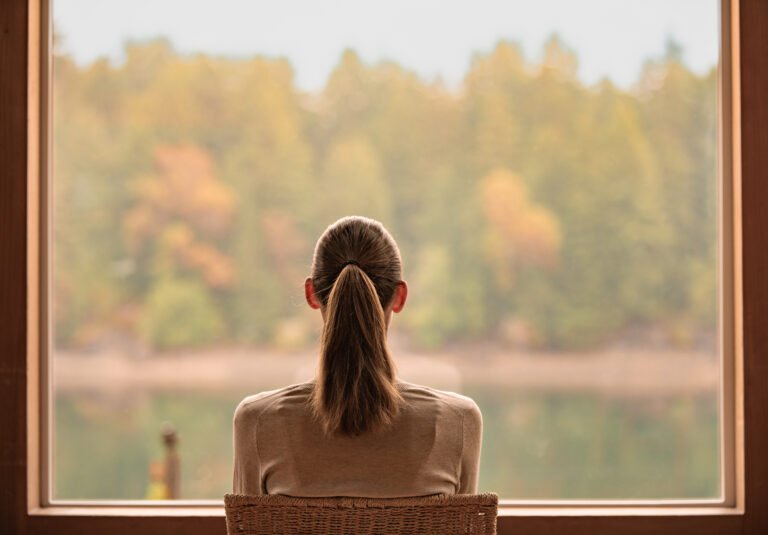 Woman looking out the window.