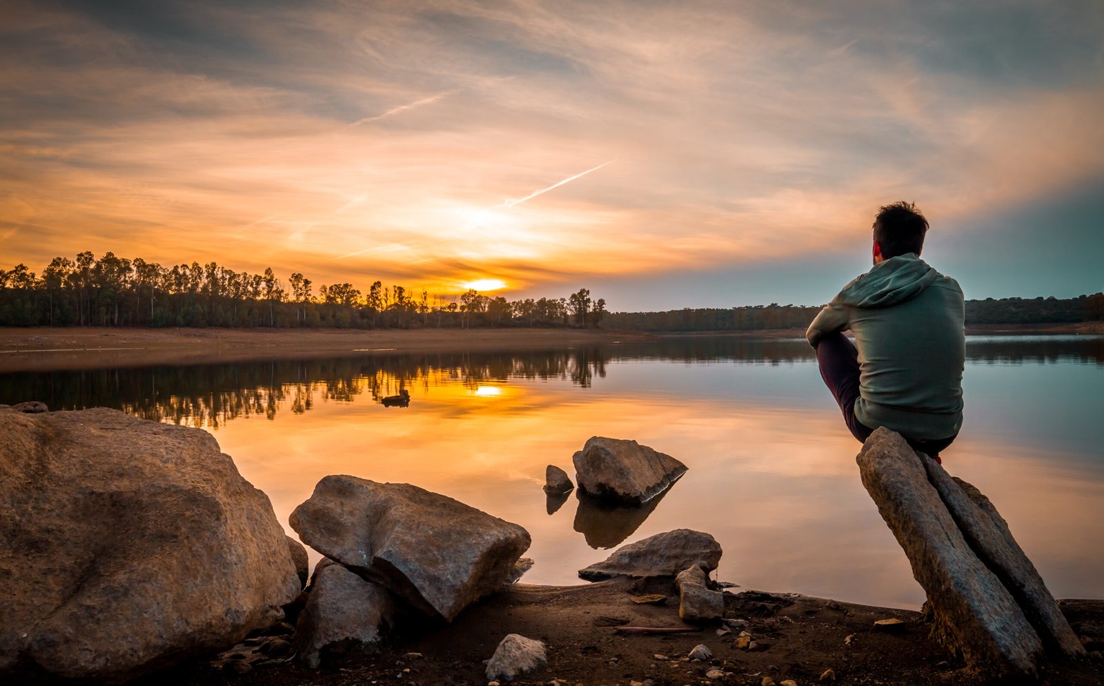 Sunset views full of colors in a reservoir with calm waters
