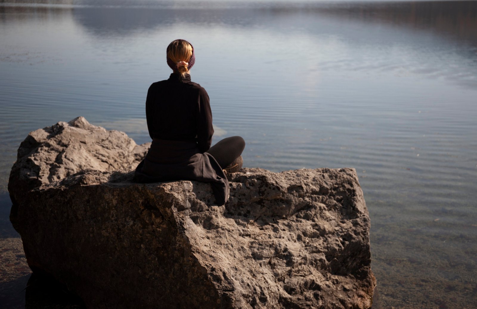 Young woman relaxing by the lake