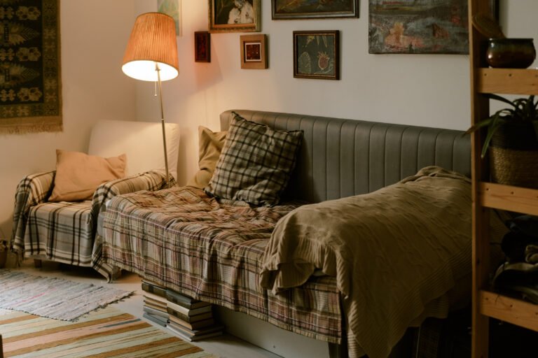 Cozy Living Room Interior Featuring Sofa and Armchair with Warm Lighting