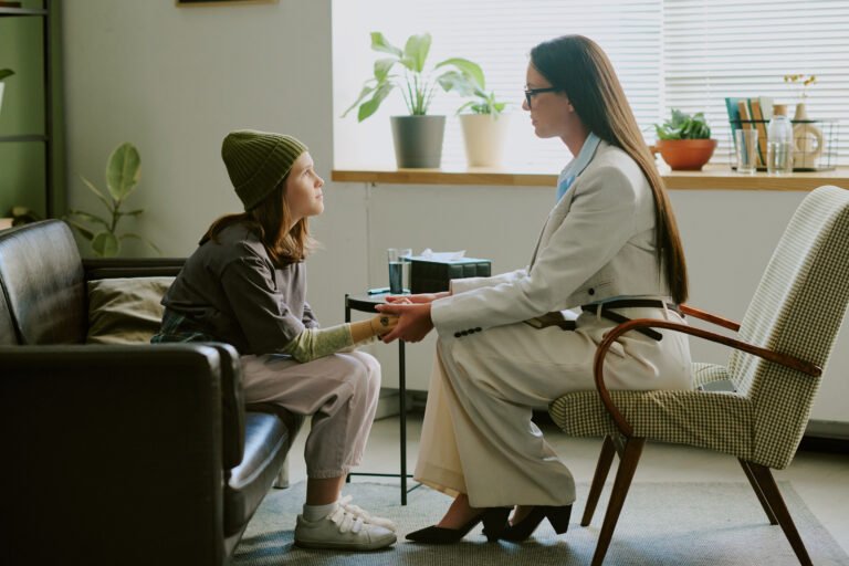 Child Receiving Counseling in Modern Office Setting