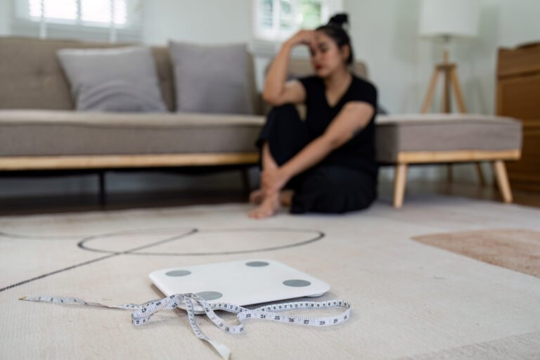 Stressful Asian overweight woman with measuring tape and sad of dieting Weight loss fail