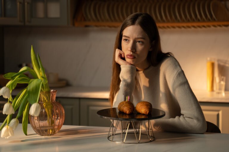 A lonely birthday celebration with croissants in the sunlit kitchen in the afternoon