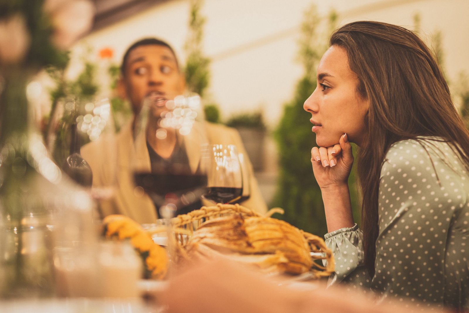 Family and friends celebrating at dinner on a rooftop terrace