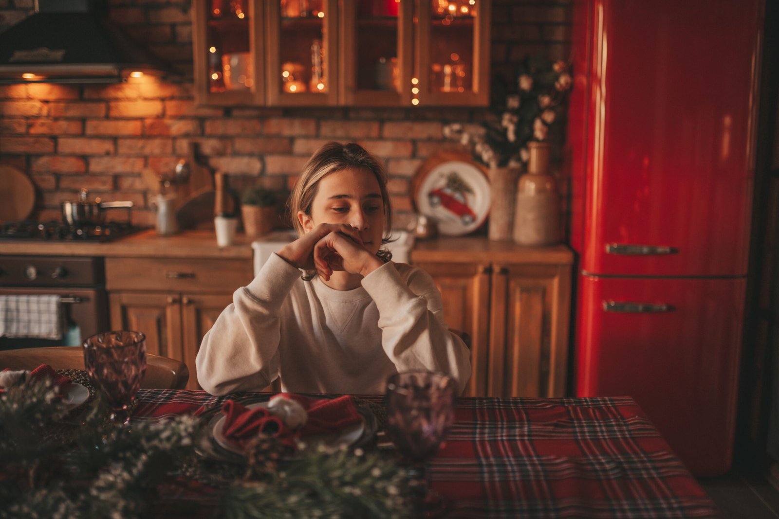 Portrait of candid authentic dreamer boy teenager in sadness depressing emotion at home Xmas