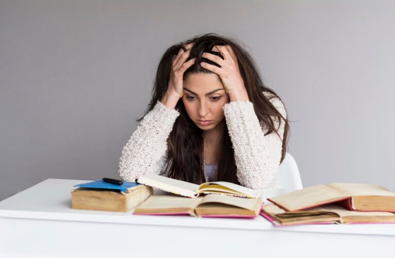 Tired student woman study for exam