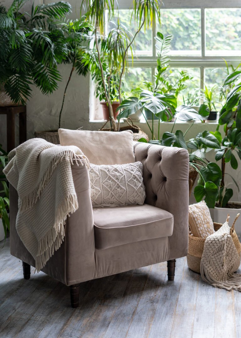 Comfortable armchair with cushion in living room