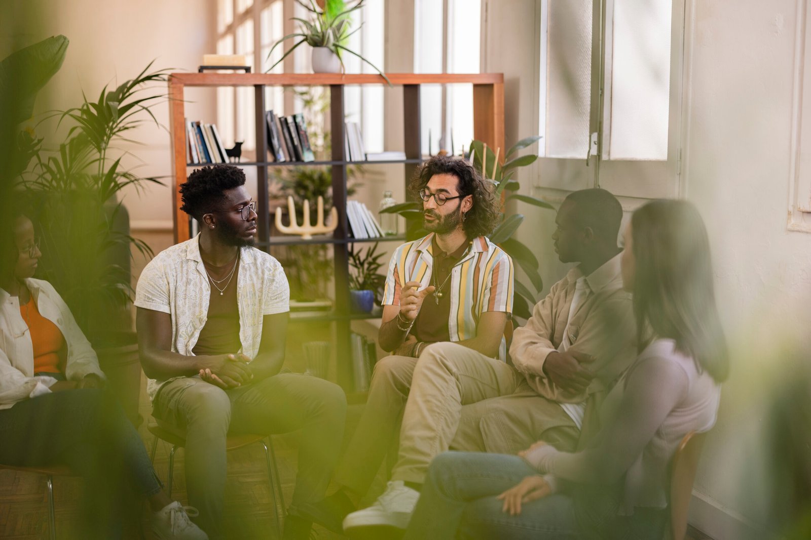 group therapy of multiracial young people in a classroom