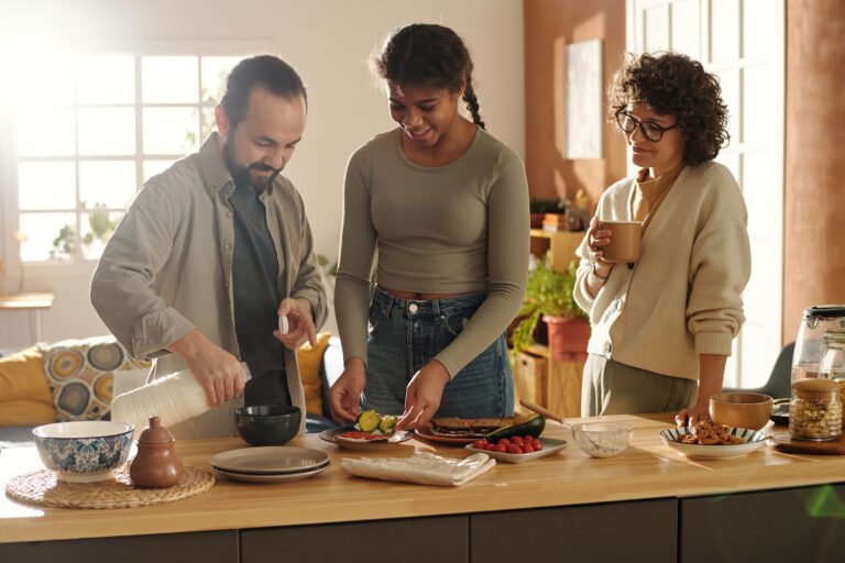 Family preparing sandwiches together